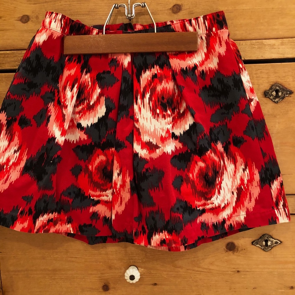 Red skirt with black and white roses on it